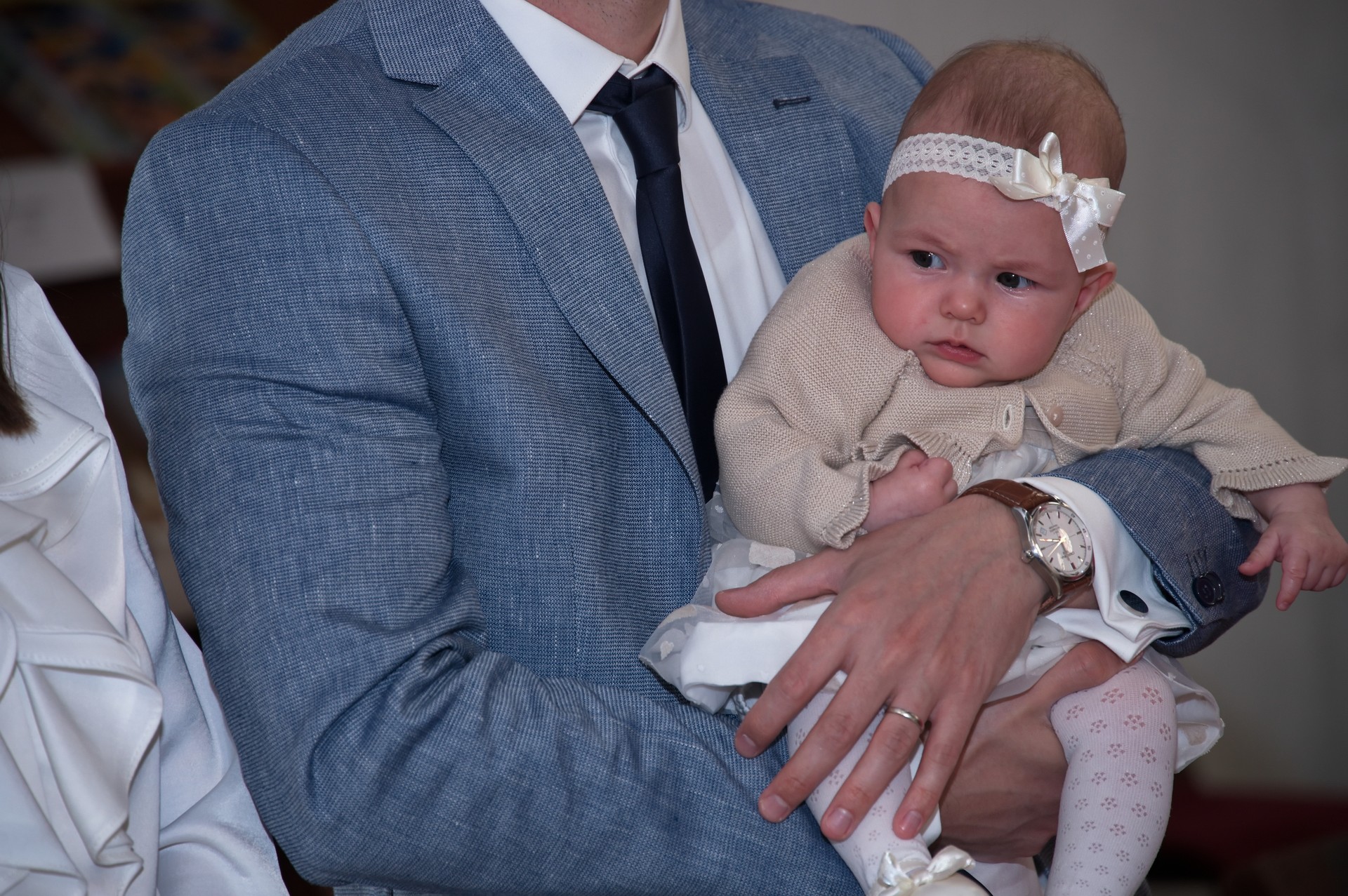 Midsection of father holding his baby girl